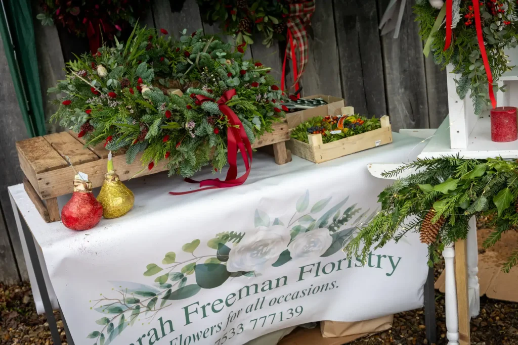 Christmas wreaths on a florist’s stall at the Ashdon Christmas Market