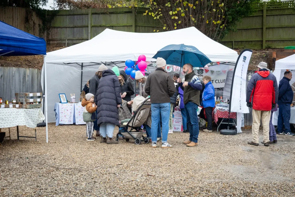 Visitors browsing the stalls at the Ashdon Christmas Market at Crown Hill, Ashdon