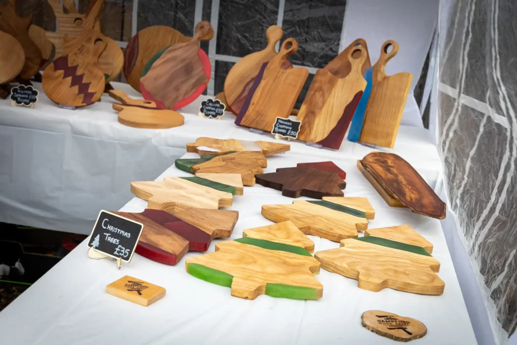 Handmade wooden chopping boards on a market stall at the Ashdon Christmas Market